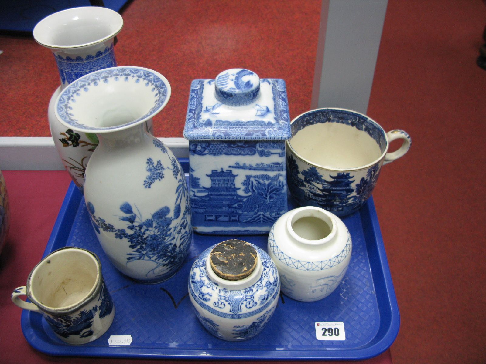 A Chinese Blue and White Vase, Ringtons blue and white tea caddy, large blue and white tea cup,