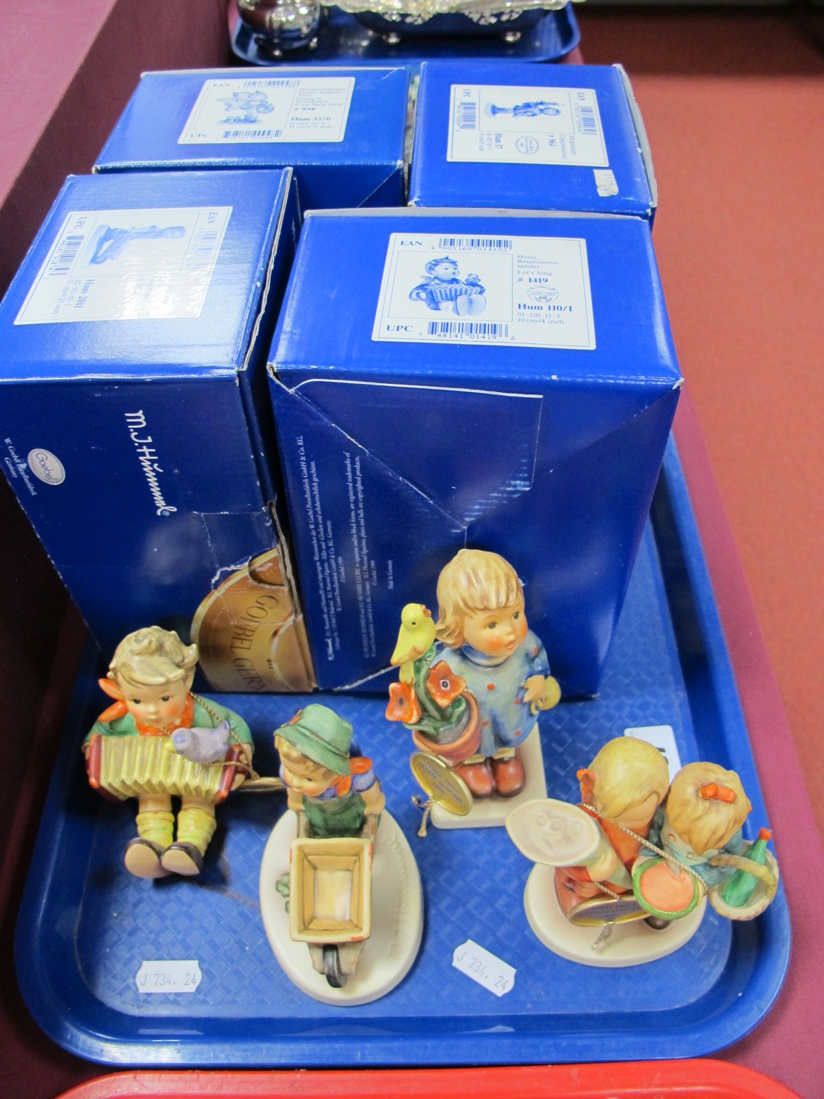 Four Boxed Hummel Figures, including 'Lets Sing, Little Landscaper, Congratulation and Going to