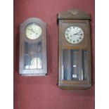 A 1940's Oak Wall Clock, with a silvered dial, glazed door, with bevelled glass panels; together