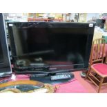 A Samsung 26" Flatscreen TV with remote.