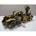 A 1940 Tinplate Clockwork Search Light Lorry by Wells Brimtoy, camouflaged finish, four wheel.