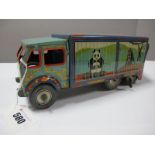 A 1950's Six Wheel Tinplate Clockwork Lorry by Mettoy, in 'Bingo's Circus' finish with replacement