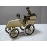 An Early XX Century Tinplate Clockwork Car Possibly by Issmayer, cream finish, fixed steering,