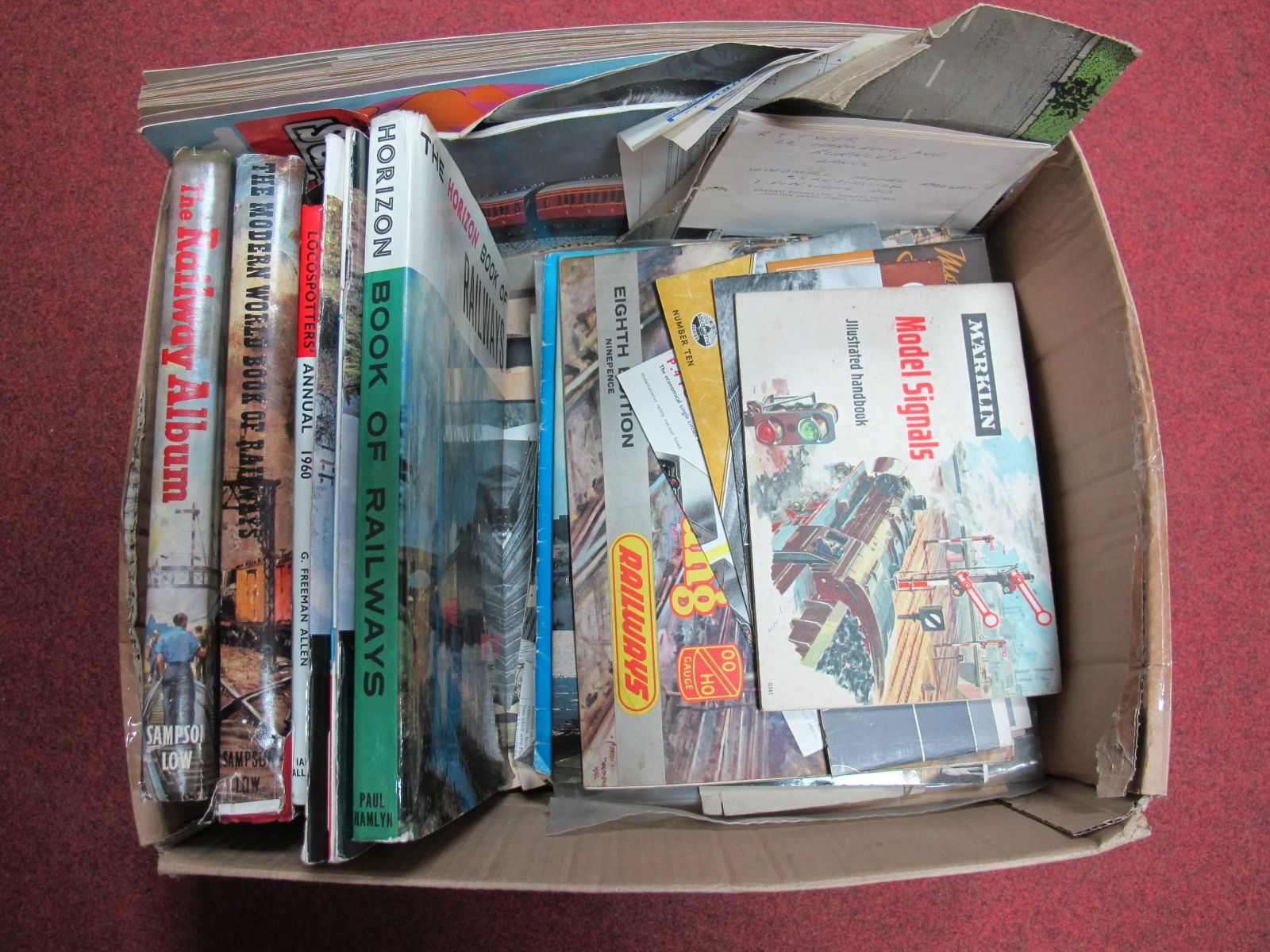 A Box Containing a Selection of Railway Related Books, and a large quantity of model train