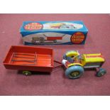 A Mid XX Century Boxed Clockwork Mettoy Mechanical Tractor and Trailer ' In Heavy Pressed Steel',