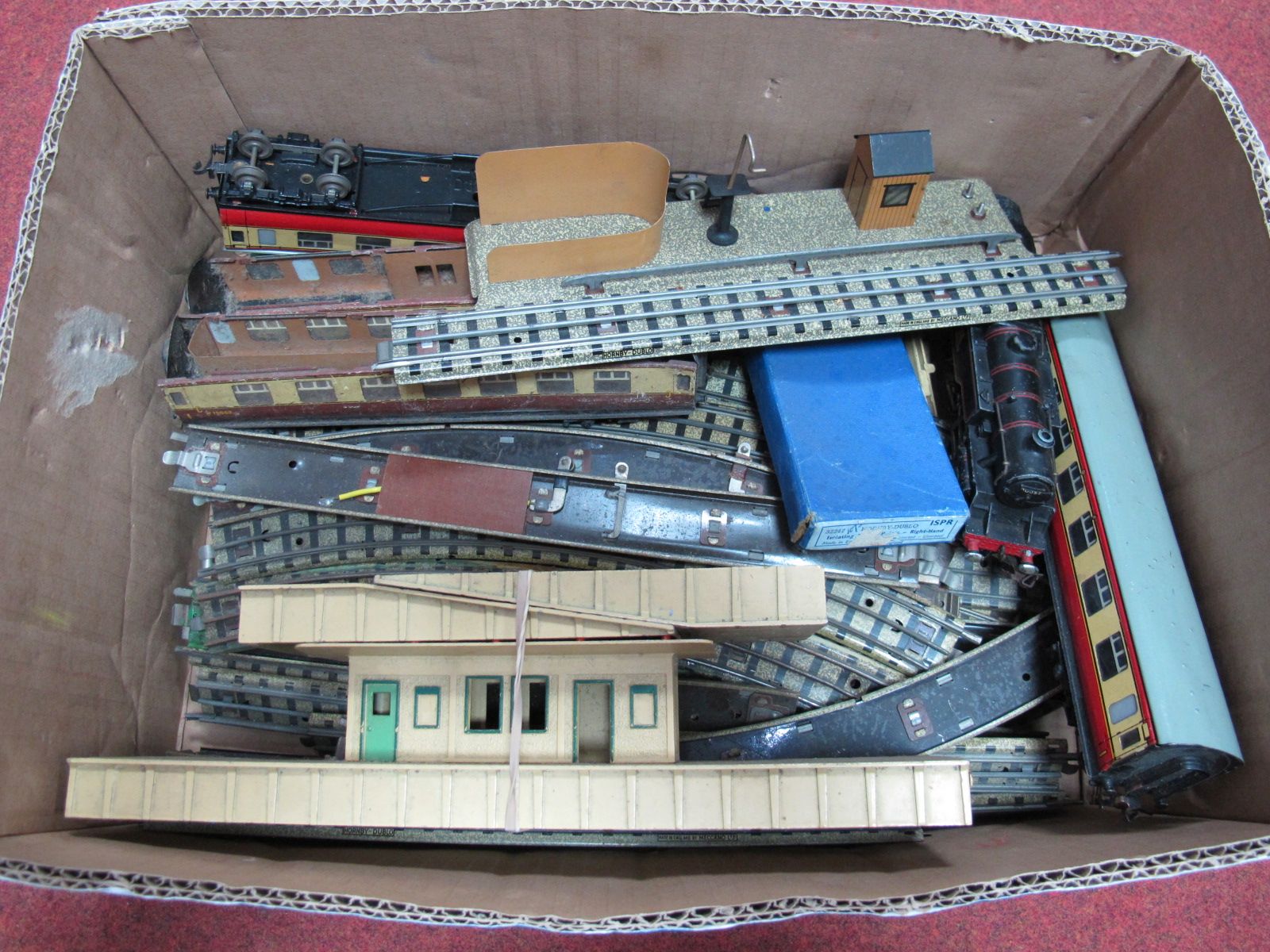 A Hornby Dublo Three Rail 2-6-4 Steam Locomotive, with platforms, carriages, three rail track and