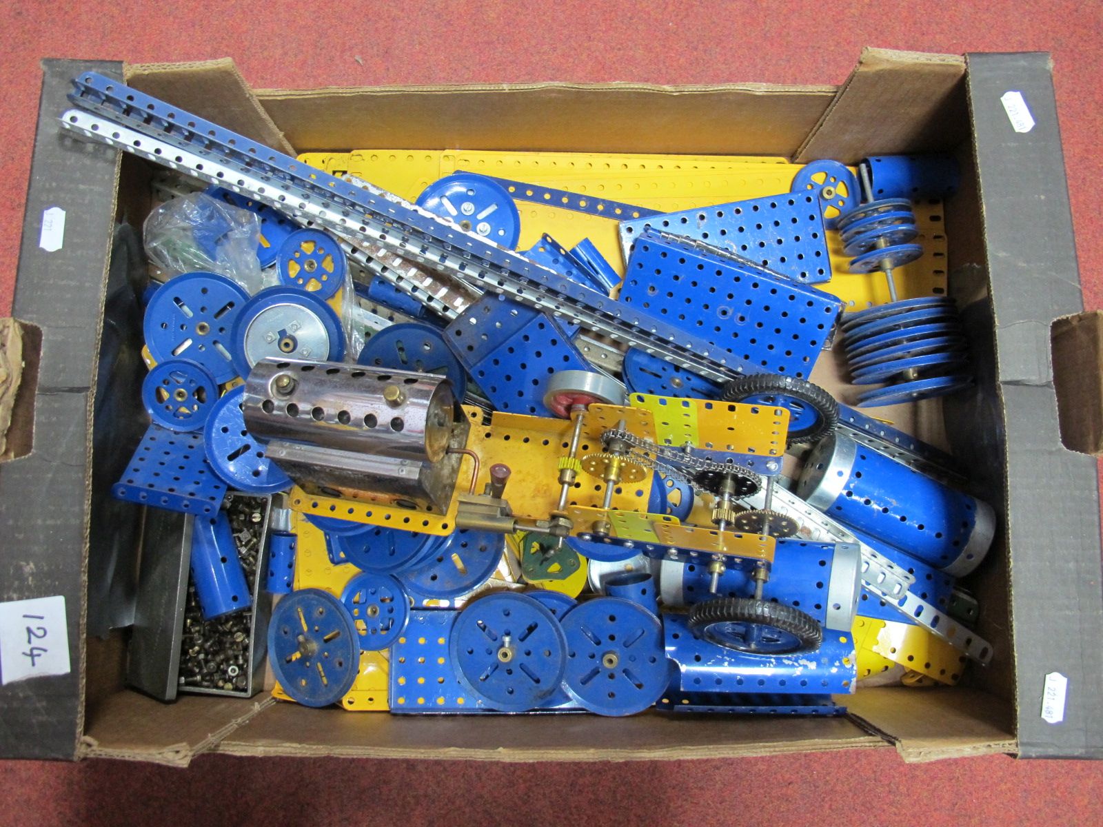 A Quantity of 1970's Blue and Yellow Meccano, including a live steam boiler, pulleys, flats, girders