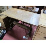 A Circa 1930's Oak Rectangular Topped Table, with trestle ends and platform feet; together with