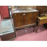 A Mid XX Century Mahogany Drinks Cabinet, with canted corners, pierced apron on cabriole legs,