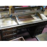 A Mid XIX Century Mahogany Pedestal Kneehole Dressing Table, with a low back, top with a moulded