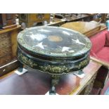 A XX Century Chinese Black Lacquer Circular Shaped Table, glass top, centre with raised figures of