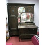 A 1920's Oak Two Piece Bedroom Suite, comprising wardrobe with a central mirror over a long