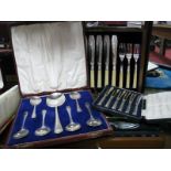 A Cased Set of Dessert Spoons, complete with serving spoon, decorative fish knives and forks,
