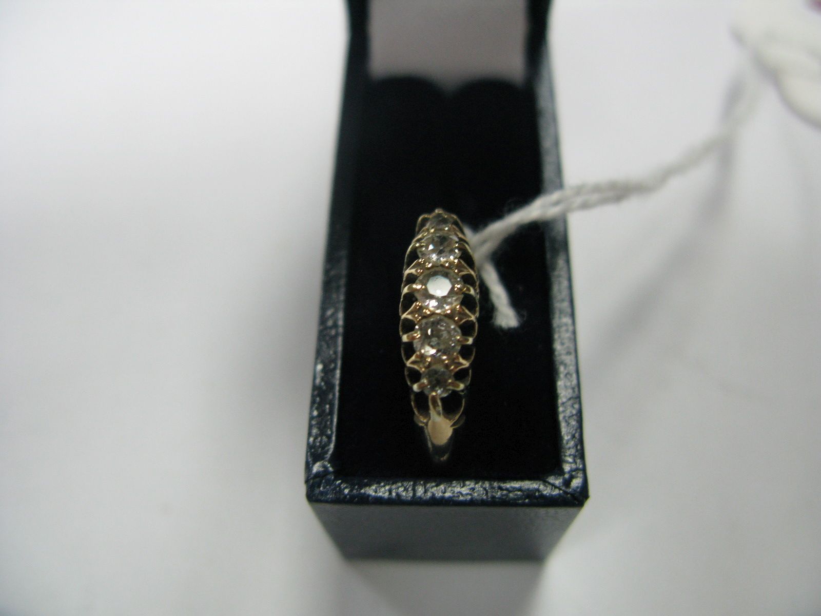 An 18ct Gold Five Stone Diamond Ring, graduated set with old cut stones.