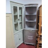 A Freestanding 'Shabby Chic' Corner Cupboard, fitted with open shelves and cupboard door; together