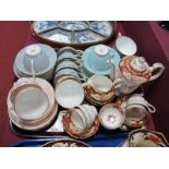 A Paragon Bone China Coffee Set, Minton 'Parkwood Pink, 'Parkwood Grey' and 'Parkwood Turquoise'