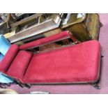 An Early XX Century Chaise Longue, with upholstered back, arm rest, and seat in a red velvet, on