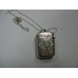 A Hallmarked Silver Vesta Case, allover leaf scroll engraved, initialled, on a chain.