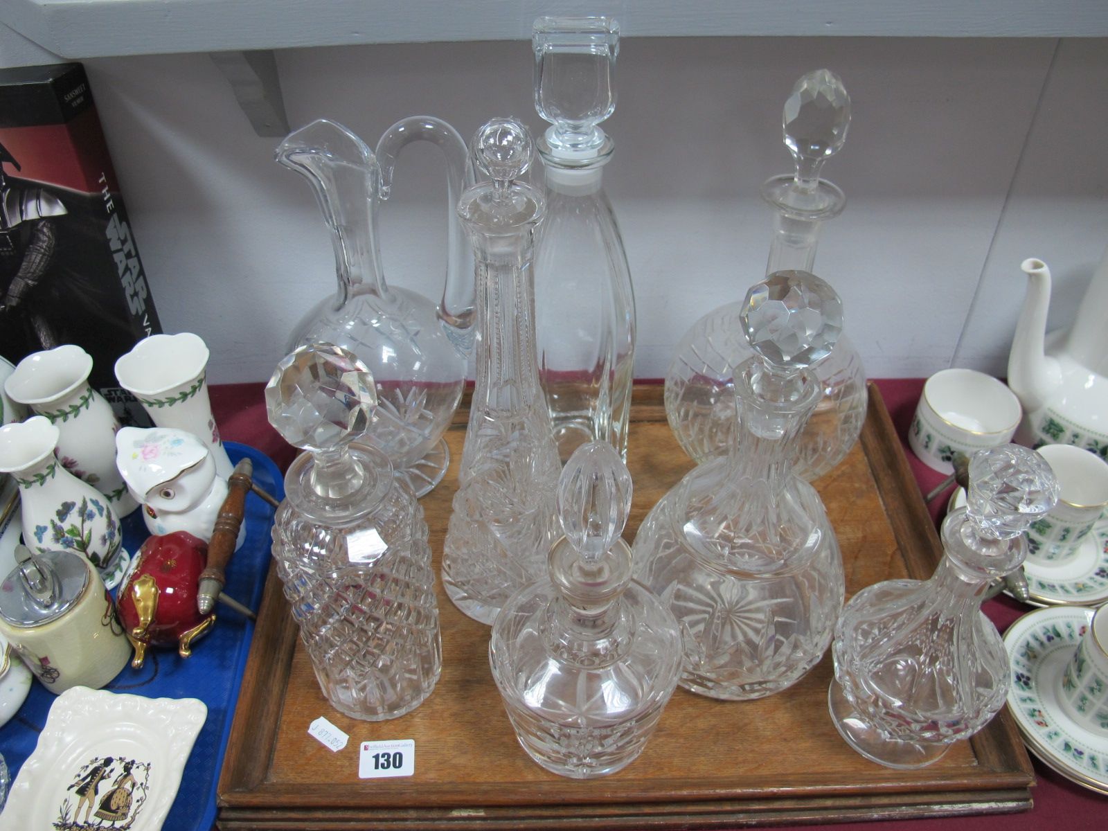 Seven Various Glass Decanters, including cut glass example and ewer.