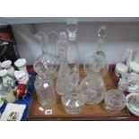 Seven Various Glass Decanters, including cut glass example and ewer.