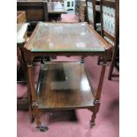 A 1920's Mahogany Two Tier Dinner Trolley, on turned and block supports, on castors.