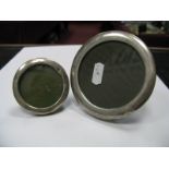 Two Hallmarked Silver Mounted Circular Photograph Frames, on easel backs. (2)