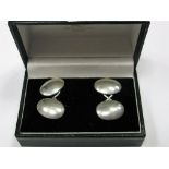 A Pair of Victorian Hallmarked Silver Cufflinks, the plain domed oval panels on figure of eight