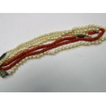 A Coral Bead Necklace, of uniform design; together with a single strand pearl bead necklace, and a