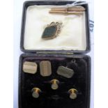 A Pair of Gent's Engine Turned Cufflinks, two 9ct gold T-bar pendants, hardstone inset swivel