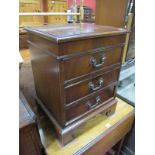 A Small XX Century Mahogany Chest of Drawers, with crossbanded top, three small drawers, on
