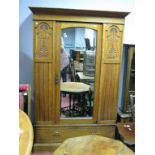 A Late XIX Century Satin Walnut Wardrobe, with a central mirror, long drawer, plinth base, (