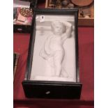 A Plaster Figure of a Cherub, in ebonised glazed case.