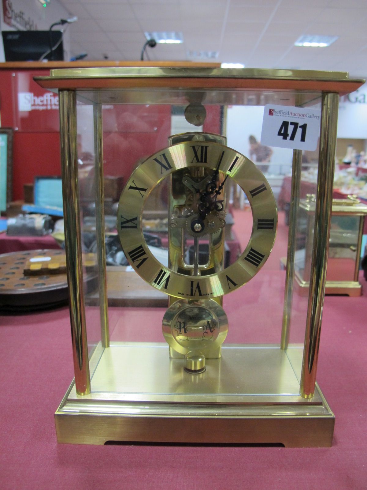 A German Acctim Quartz Brass Cased Skeleton Clock, by S. Haller.