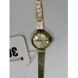 Rotary; A 9ct Gold Cased Ladies Wristwatch, the signed dial with baton markers, to integral textured