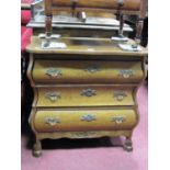 A XX Century Dutch Style Bombe Commode, with a serpentine shaped top, three long drawers, on claw