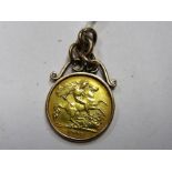 A George V Half Sovereign, within applied pendant mount.