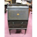 An Edwardian Inlaid Mahogany Bureau, with gallery back, fall front, twin drawers and tapering legs.