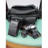 A Cased Minolta X-300 35mm Film Camera, Minolta MD 50mm F1.7 lens, Sigma 35-70mm F2.8-4 lens,