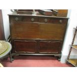 A 1920's Mahogany Drinks Cabinet, with a low back, top with a gadrooned edge, two short drawers,