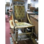 An Early XX Century American Style Rocking Chair, with upholstered back and seat, turned legs on