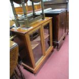 A Mahogany Walnut Bookcase, with twin glazed doors, on cabriole legs, together with a mahogany