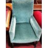 A XIX Century Armchair, upholstered in turquoise velvet, on turned forefront legs.