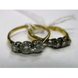 A Three Stone Diamond Ring, the graduated old brilliant cut stones claw set; together with a smaller