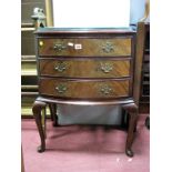 A Mid XX Century Mahogany Three Drawer Bow Fronted Chest, on cabriole legs.