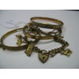 A Charm Bracelet, to heart shape padlock clasp; together with two hinged bangles and a (possibly)