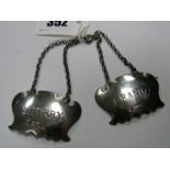 A Pair of Hallmarked Silver Decanter Labels, "Sherry", "Brandy", FH, Sheffield 1977, each on chain