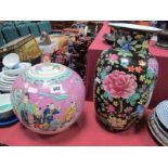 A Large XIX Century Chinese Ginger Jar and Cover, decorated with many figures on a pink ground, 23cm