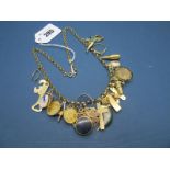 A Charm Necklace, the belcher link chain suspending numerous assorted pendants, including loose