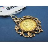 A George V Half Sovereign, 1911, loose set within 9ct gold pendant mount, of scroll design.