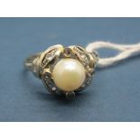 A Pearl Set Dress Ring, with collet set highlights, stamped.